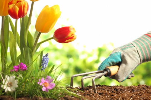 Close-up of gardening tools and a clipboard used for accessible service notes